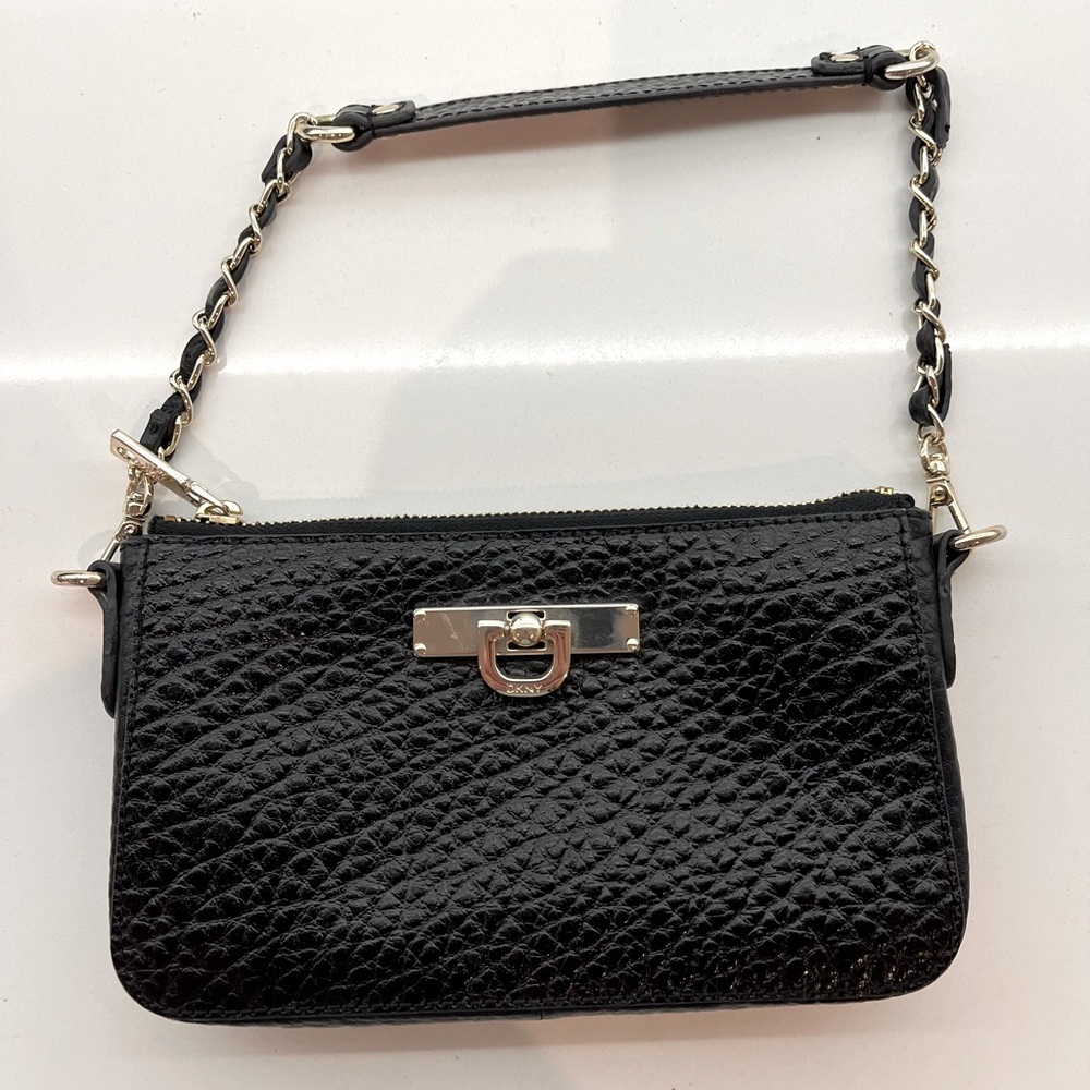 DKNY 
Black crossbody plus gold chained single handle.